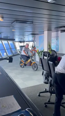 #captain #driving #motorcycle on the #navigationbridge #with #great #confidence #harmonyoftheseas #big #bridge from #starboard to #port #side is 60 meter. #fun at the #helm when the #cruiseship is #docked