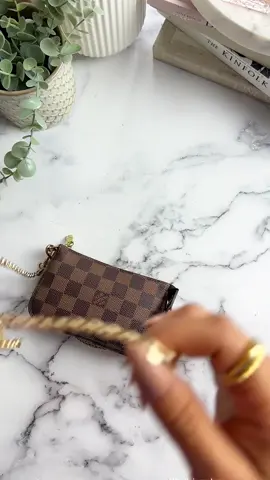 That’s a Mini Pochette?!👀🤯 The OG Mini Pochette packs a PUNCH! 👊👊 While it can’t fit my phone, it truly does fit all of the essentials, and I love that I can add a chain to make it wearable (chain sold separately; I’m showing one found in my Amazon Storefront).  Do you use your SLGs as bags? Would you wear the Mini Pochette like this? Share below!🤍 *Everything shown is real and from my own collection. I don’t sell. Chain sold separately and not tied to the brand, shown for styling purposes.  Tags🏷️ WIMB, what’s in my bag, BOTD, bag of the day, organize with me, ugc creator, luxe beauty, mini makeup, asmr sounds, slgs, mini bag #wimb #whatsinmybag #botd #bagoftheday #minimakeup #minipochette #ugccreator #luxebeauty #asmrrelax #asmrcommunity #slg 