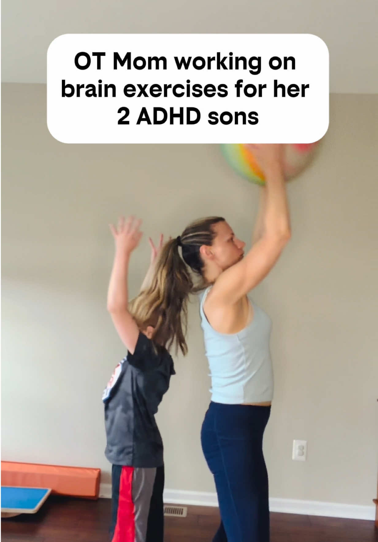 One ball. Two moves. A LOT happening in the ADHD brain. 🧠 🔹 Crossing midline 🔹 Bilateral coordination 🔹 Motor planning 🔹 Body awareness 🔹 Core control 🔹 Timing + coordination 🔹 Working memory 🔹 Response inhibition The goal isn’t to “burn off energy.” It’s to give the brain and body a job to do together. Try it for 1 minute at a time.  Go slow and stop if you have any dizziness  Save this + follow @modernmomuniversity for practical ADHD + sensory strategies from an OT mom. #ADHDKids #ADHDParenting #SensoryProcessing #OccupationalTherapy