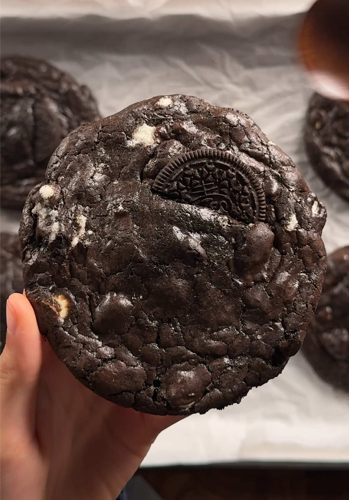 cookies n cream brownie cookies 2 cups (340g) bittersweet or semisweet chocolate 3/4 cup (170g) unsalted butter 1/2 cup (100g) white sugar 1 1/3 cups (270g) brown sugar 4 eggs 2 tsp (8g) vanilla extract 1 1/2 cups (190g) ap flour 1/2 cup (50g) dutch process cocoa powder 3/4 tsp (4g) salt 3/4 cup (100-120g) oreo cookies 1 cup (150-180g) white chocolate chips +extra oreos for assembly. *in a microwave safe bowl, gradually microwave the butter and chocolate together until its smooth. do it in 15-20 sec increments to not burn the chocolate. whisk in the cocoa powder while its still warm and then set this aside. in a large bowl, whisk together the eggs and sugars together well until its foamy. then add in the cooled chocolate/butter mixture and mix until combined. then add in the vanilla. gently mix in the dry ingredients. then fold in the chopped oreos and white chocolate. set in the fridge for an hour. scoop and place a oreo on the bottom, then bake at 350 for 11-14 min or until the top looks set and crackly a bit! #cookiesandcream #brownie #cookies 