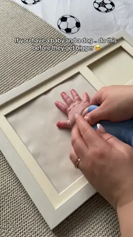 Would you do this with yours? 🥹 #babyanddog #dogmom #newmom #babyfirst #pawprint 