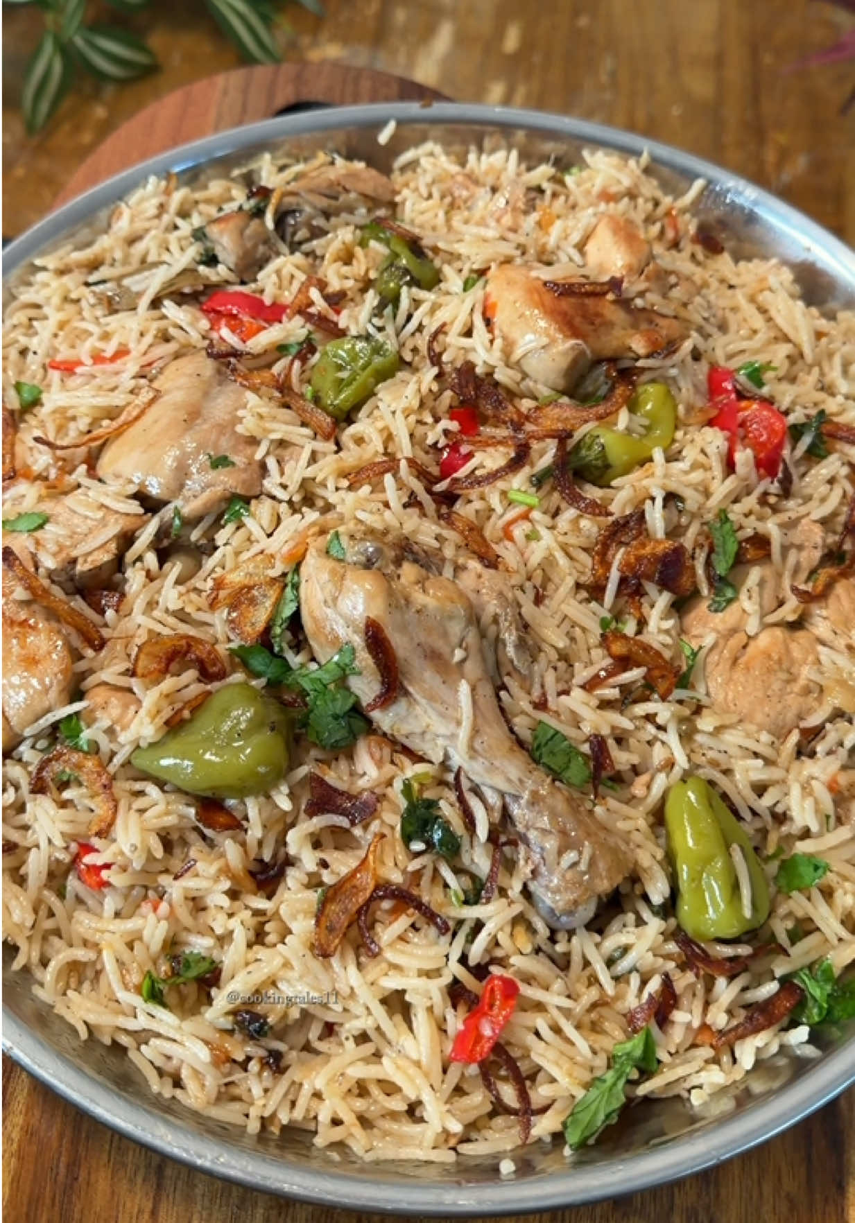 Chicken pulao  Ingredients: 5 tbsp oil 2 white onions, sliced ½ chicken 2 tomatoes, chopped 1 tbsp ginger-garlic paste ¼ cup yogurt 1 glass rice, soaked 2 glasses water 1 tbsp salt 1 tbsp black pepper powder 1 tbsp garam masala 1 tbsp coriander powder 1 tbsp whole cumin 2 bay leaves 2 cinnamon sticks 5–6 cloves 3 whole dried red chillies Whole green chillies 1 red pepper, sliced Chopped coriander Fried onions Method: Heat oil and sauté onions until slightly golden.Add bay leaves, cinnamon, cloves, cumin and dried red chillies. Fry briefly. Add chicken and fry until lightly golden. Add ginger-garlic paste, yogurt and powdered spices. Sauté well. Add tomatoes and cook briefly. Pour in water, add salt and bring to a boil. Add soaked rice and cook until the water is mostly absorbed. Add green chillies, sliced red pepper, chopped coriander and fried onions. Cover and cook on dum for 15 minutes. Serve and enjoy! #fyp #chickenpulao #viral #healthy #cookingtales11