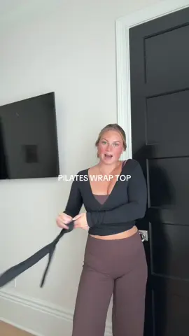 As a girl who wears a million outfits every day… this is my most worn top!! #wraptop #pilatesootd #pilates #workouttop 