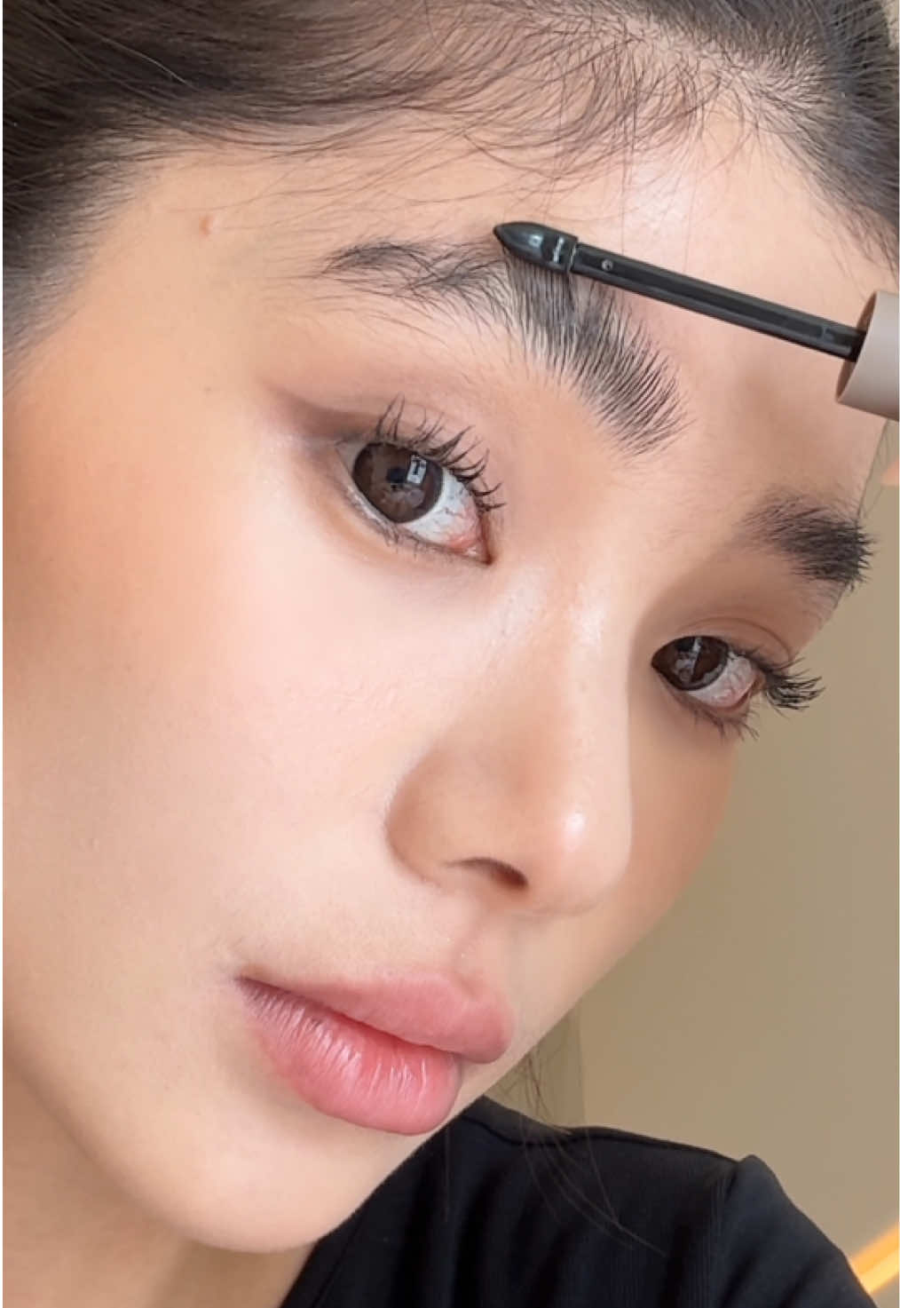 Not just for brows....👀🤎 A little brow gel, a little beauty hack!  JUDYDOLL Lock & Lift Tinted Brow Gel helps lift, shape, and keep your brows looking sleek and defined. And those little flyaways? A quick swipe helps smooth them down, too! ✨ From polished brows to a clean-sleek hair look, it’s all about the little details. 💕 Have you tried this beauty hack yet? 👀 Featuring: JUDYDOLL Lock & Lift Tinted Brow Gel #JUDYDOLL #JUDYDOLLGoesGlobal #browgel #browshaping #eyebrow  