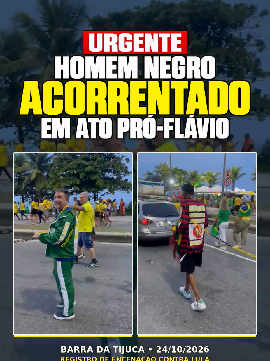 Um homem negro aparece com uma corrente segurada por outro manifestante em um ato pró-Flávio Bolsonaro na Barra da Tijuca, no Rio, em 24/10/2026. A cobertura do Terra descreve a cena como uma encenação contra Lula. O registro não esclarece a relação entre os participantes nem as circunstâncias do uso da corrente. Assista ao trecho: o que você acha dessa cena? #FlavioBolsonaro #Lula #BarraDaTijuca #RioDeJaneiro #Eleicoes2026